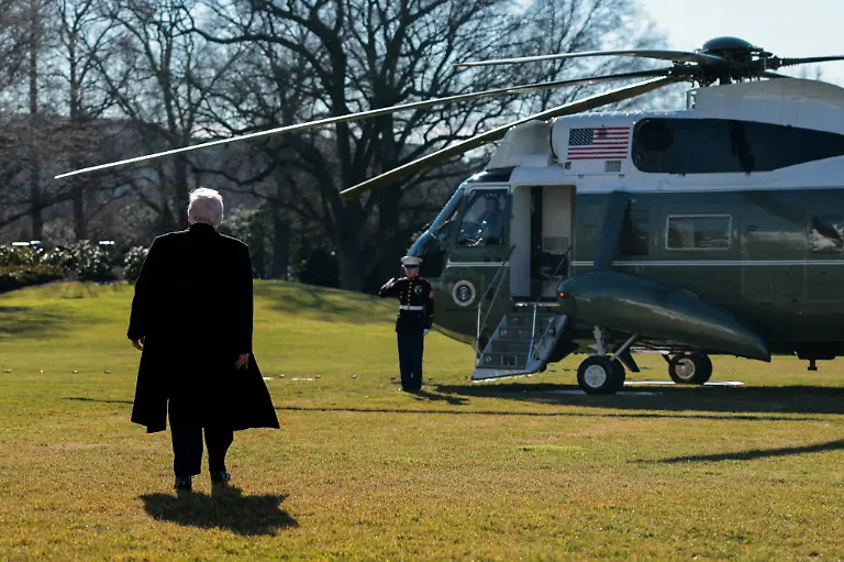 U-S-President-Donald-Trump-walks-towards-the-Marine-One-helicopter-to-depart-the-White-House-for-travel-to-Detroit-Michigan-in-Washington-D-C-U-S-January-13-2026