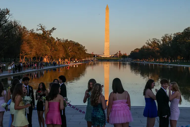 Students-gather-along-the-National-Mall-near-the-Reflecting-Pool-before-a-school-dance-in-Washington-D-C-U-S-October-18-2025