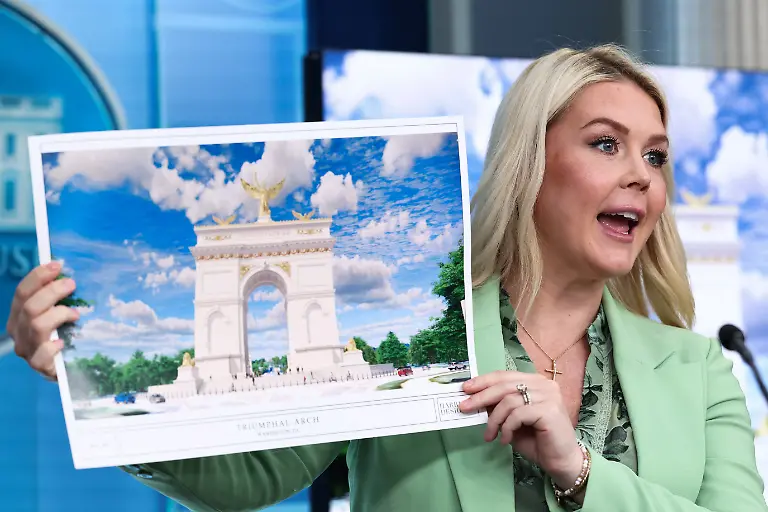 White-House-Press-Secretary-Karoline-Leavitt-holds-a-rendering-of-U-S-President-Donald-Trump-s-proposed-Independence-Arch-during-a-press-briefing-in-the-James-S-Brady-Press-Briefing-Room-at-the-White-House-in-Washington-D-C-U-S-April-15-2026