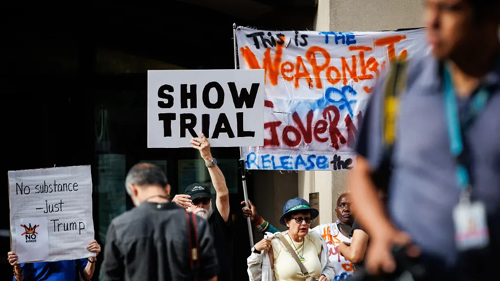 Protestors-supporting-former-FBI-Director-James-Comey-gather-outside-of-the-Albert-V-Bryan-U-S-Courthouse-on-October-8-2025-in-Alexandria-Virginia-Comey-was-arraigned-on-two-federal-charges-today-and-plead-not-guilty-to-both