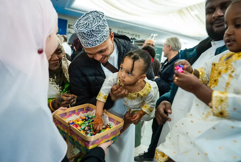 THE-CANADIAN-PRESS-2026-03-20-Young-girls-receive-sweets-after-celebrating-Eid-al-Fitr-at-an-ISNA-Canada-mosque-in-Mississauga-Ont-on-Friday-March-20-2026