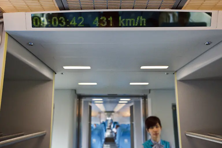 The-Shanghai-Transrapid-maglev-train-The-line-runs-from-Longyang-Road-station-in-Pudong-to-the-Pudong-International-Airport-The-journey-takes-7-minutes-and-20-seconds-to-complete-the-distance-of-30-km-and-reaches-a-maximum-normal-operation-speed-of-431-km-h-268-mph-The-Maglev-system-was-developed-and-marketed-by-Transrapid-International-a-joint-venture-of-Siemens-AG-and-ThyssenKrupp-AG-This-is-the-first-commercial-application-of-maglev-technology