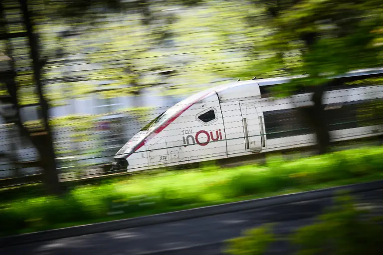 This-photograph-shows-a-TGV-inoui-high-speed-train-of-the-French-national-SNCF-rail-company-SNCF-running-in-Nantes-western-France-on-April-4-2025
