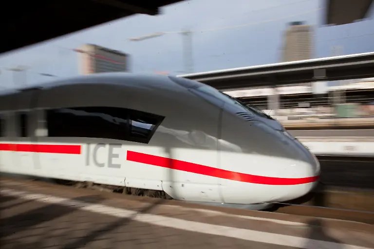 A-Siemens-AG-407-series-InterCity-Express-ICE-3-Velaro-D-train-operated-by-Deutsche-Bahn-AG-leaves-the-central-railway-station-in-Frankfurt-Germany-on-Tuesday-Feb-18-2014-Siemens-AG-said-the-first-four-of-16-trains-ordered-by-Deutsche-Bahn-AG-received-regulatory-approval-to-operate-two-years-after-delays-on-the-new-model-started-burdening-earnings-at-Europe-s-largest-engineering-company