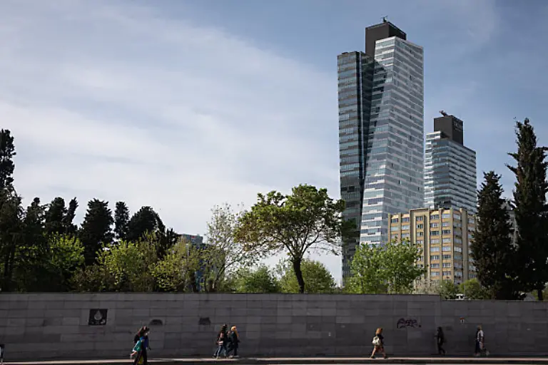 On-4-May-2021-residents-of-Istanbul-Turkey-began-the-work-week-under-strict-Covid-19-curfews-designed-to-encourage-social-distancing-and-keep-many-workers-home-in-effort-to-reduce-a-surge-in-coronavirus-cases-Above-pedestrians-walk-near-the-Istanbul-Trump-Towers-in-the-city-s-Sisli-district