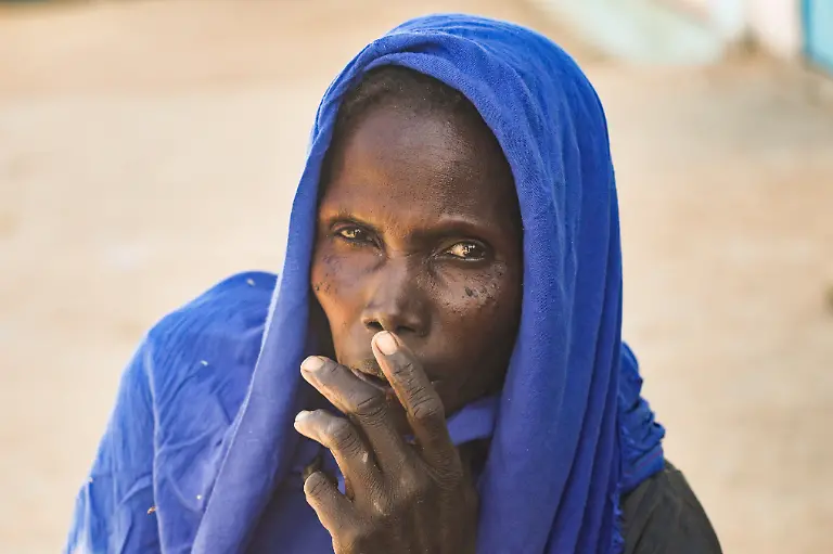 Khadija-Isa-35-a-Sudanese-refugee-from-Al-Fashir-looks-on-during-an-interview-with-Reuters-amid-ongoing-conflict-in-Sudan-between-the-paramilitary-Rapid-Support-Forces-RSF-and-the-Sudanese-army-at-the-Tine-transit-camp-in-eastern-Chad-November-23-2025-REUTERS-Amr-Abdallah-Dalsh-SEARCH-ABDALLAH-DALSH-SUDAN-SURVIVORS-FOR-THIS-STORY-SEARCH-WIDER-IMAGE-FOR-ALL-STORIES