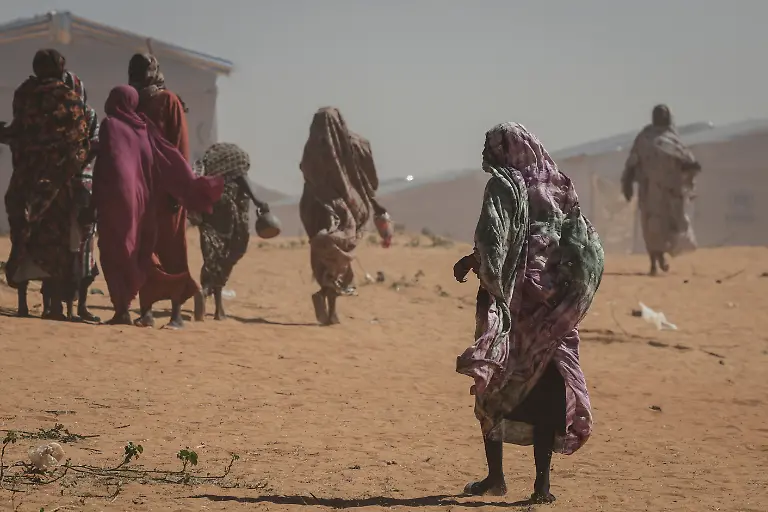 Sudanese-refugee-women-walk-at-the-Tulum-refugee-camp-amid-ongoing-conflict-in-Sudan-between-the-paramilitary-Rapid-Support-Forces-RSF-and-the-Sudanese-army-in-Wadi-Fira-province-eastern-Chad-November-30-2025-REUTERS-Amr-Abdallah-Dalsh-SEARCH-ABDALLAH-DALSH-SUDAN-SURVIVORS-FOR-THIS-STORY-SEARCH-WIDER-IMAGE-FOR-ALL-STORIES