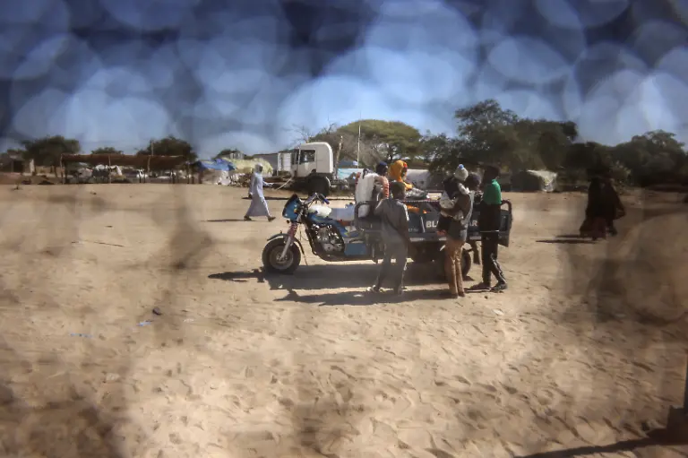 A-Sudanese-refugee-father-from-Al-Fashir-rides-on-a-motorized-cart-with-his-family-travelling-between-Chad-and-Sudan-amid-the-ongoing-conflict-between-the-paramilitary-Rapid-Support-Forces-RSF-and-the-Sudanese-army-at-the-Tine-border-post-in-eastern-Chad-November-22-2025-REUTERS-Amr-Abdallah-Dalsh-TPX-IMAGES-OF-THE-DAY-SEARCH-ABDALLAH-DALSH-SUDAN-SURVIVORS-FOR-THIS-STORY-SEARCH-WIDER-IMAGE-FOR-ALL-STORIES