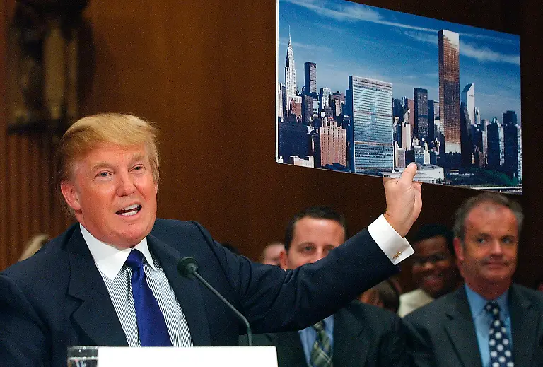 FILE-In-this-July-21-2005-file-photo-Donald-Trump-holds-a-picture-of-the-New-York-City-skyline-while-testifying-on-renovation-of-the-United-Nations-Headquarters-on-Capitol-Hill-When-President-Donald-Trump-visits-the-United-Nations-building-in-New-York-he-s-not-just-thinking-about-the-global-challenges-the-world-body-faces-he-s-still-got-in-mind-the-deal-that-got-away-More-than-a-decade-later-Trump-still-relives-the-overtures-he-made-to-rebuild-the-39-story-tower-in-the-early-2000s-and-posits-that-he-could-have-done-a-better-job-of-it