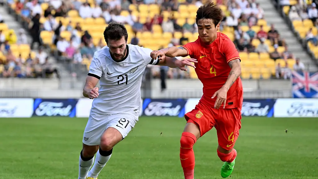 FILE-Tim-Payne-left-of-the-All-Whites-and-Shihao-Wei-of-China-compete-for-the-ball-during-the-international-soccer-friendly-between-New-Zealand-and-China-in-Wellington-New-Zealand-Sunday-March-26-2023
