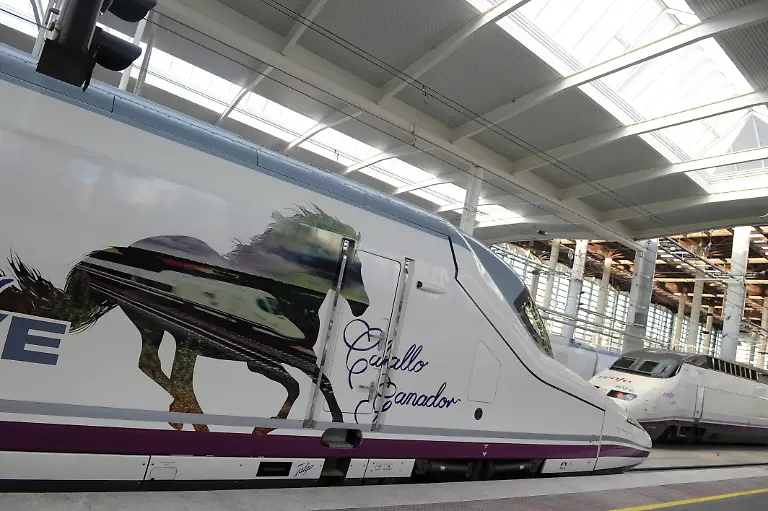 A-Talgo-350-high-speed-train-AVE-Alta-Velocidad-Espanola-meaning-Spanish-high-speed-is-seen-at-the-train-station-of-Atocha-of-Madrid-on-December-15-2010-prior-to-the-inauguration-of-the-Spanish-high-speed-train-s-track-connecting-Madrid-to-Albacete-in-eastern-Spain-Text-reads-in-Spanish-Winning-horse
