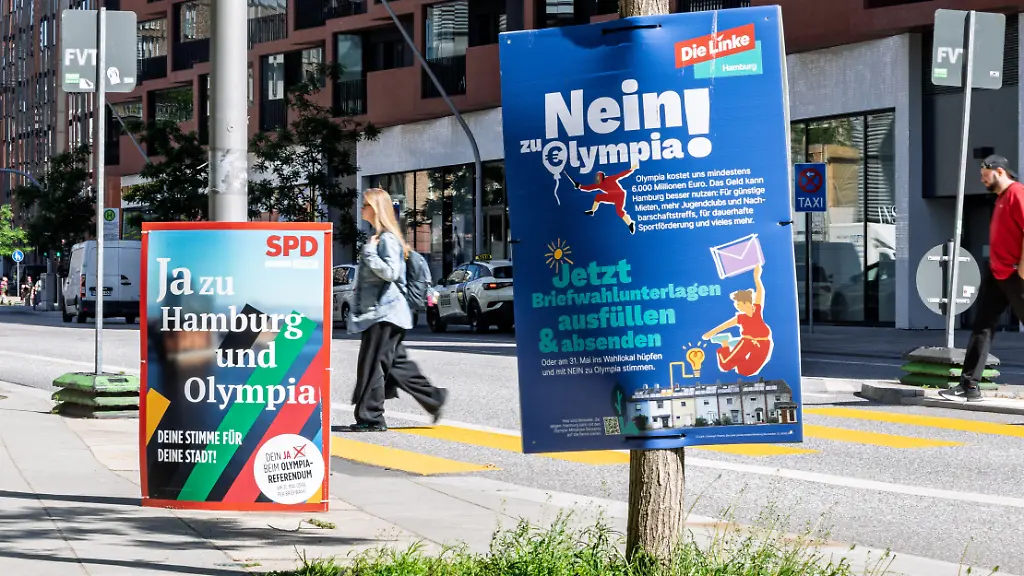 Zwei-Plakate-werben-mit-gegensaetzlichen-Positionen-zur-Olympia-Bewerbung-darunter-Ja-zu-Hamburg-und-Olympia-SPD-und-Nein-zu-Olympia-Die-Linke-In-Hamburg-laeuft-die-Kampagne-vor-dem-Referendum-ueber-eine-moegliche-Olympiabewerbung-der-Stadt
