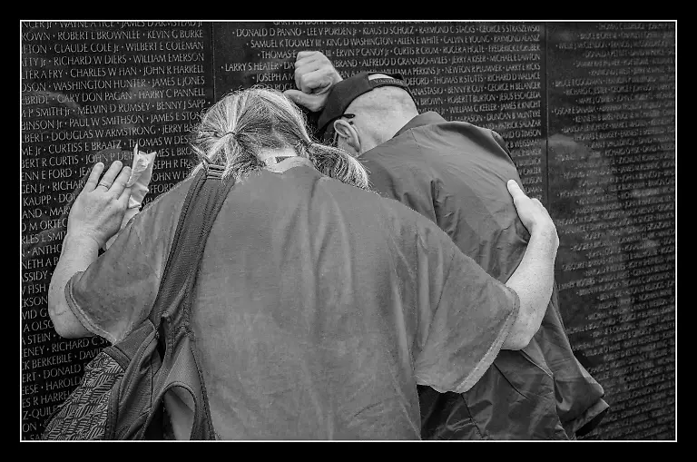 I-am-honored-to-be-one-of-the-official-photographers-for-Old-Dominion-Honor-Flight-an-organization-that-takes-our-WWII-Korea-and-Vietnam-Veterans-to-Washington-D-C-to-visit-the-memorials-dedicated-to-their-military-service-for-our-great-nation-Each-Veteran-has-a-volunteer-Guardian-who-accompanies-him-or-her-throughout-the-day-to-make-sure-the-honoree-feels-safe-comfortable-and-supported-as-we-travel-from-museums-to-memorials-to-Arlington-Cemetery-then-back-home-to-Richmond-VA-Experiencing-the-Vietnam-Veterans-Memorial-is-often-an-emotional-and-moving-experience-for-both-the-Veterans-and-their-Guardians-This-is-one-of-those-moments-The-Veteran-on-the-right-was-overcome-with-emotion-just-after-he-was-honored-for-his-service-at-the-place-on-the-wall-where-he-found-the-etched-name-of-a-brother-in-arms-who-gave-his-all-and-never-returned-from-Vietnam-I-am-always-humbled-by-both-those-Veterans-who-served-and-experienced-unspeakable-tragedy-and-loss-and-also-by-the-Guardians-who-donate-their-time-and-money-to-support-our-heroes-on-these-missions