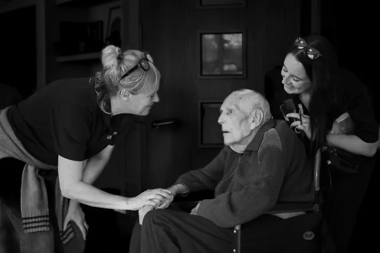 This-photo-is-part-of-a-series-of-work-taken-over-a-lengthy-period-in-a-residential-home-for-the-elderly-Titled-Still-Here-Relationships-that-Endure-Beyond-View-which-looks-at-resident-to-resident-resident-to-carer-and-resident-to-family-relationships-with-the-care-home