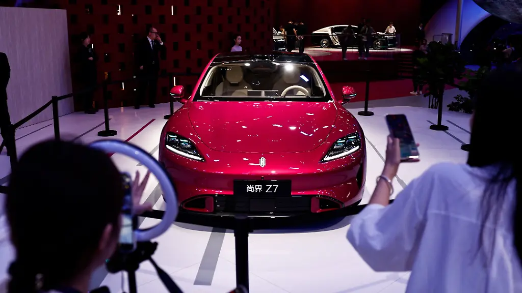 Staff-members-conduct-a-live-streaming-session-to-promote-SAIC-Z7-electric-sedan-at-the-Beijing-International-Automotive-Exhibition-Auto-China-in-Beijing-China-April-24-2026