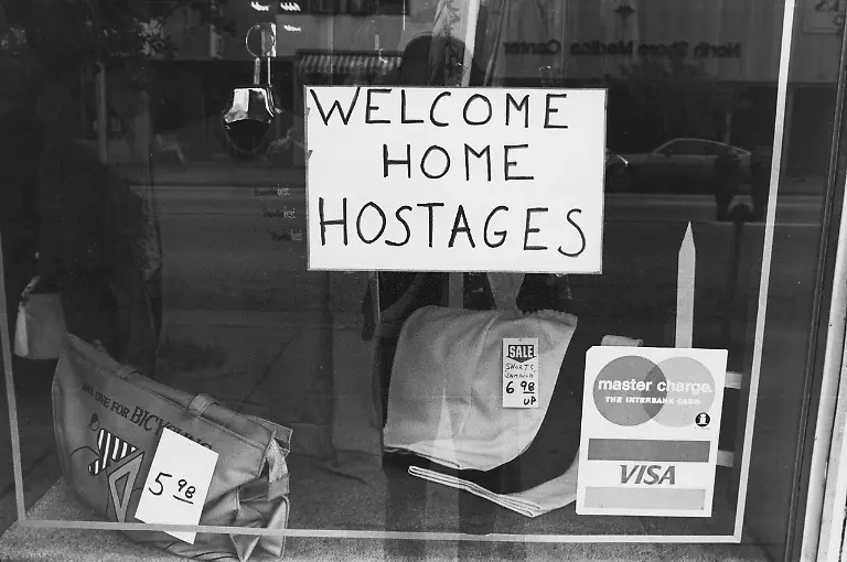 A-sign-in-a-store-window-in-Miami-Beach-Florida-proclaiming-Welcome-Home-Hostages-25th-January-1981-It-refers-to-the-end-of-the-Iran-hostage-crisis-and-the-release-of-the-52-American-diplomats-and-citizens-from-the-US-Embassy-in-Tehran