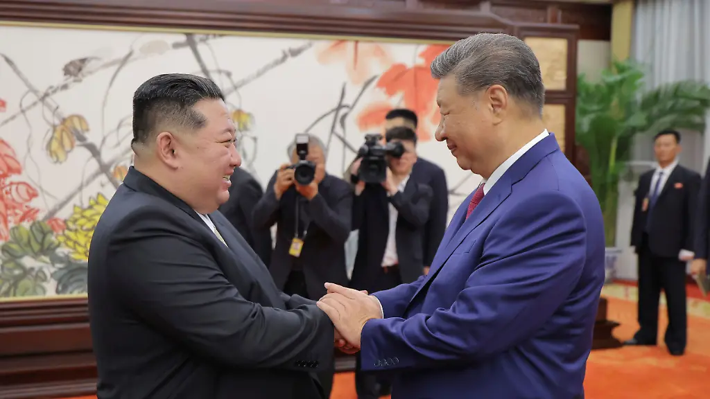 In-this-photo-provided-by-the-North-Korean-government-North-Korean-leader-Kim-Jong-Un-left-shakes-hands-with-Chinese-President-Xi-Jinping-in-Beijing-Thursday-Sept-4-2025-Independent-journalists-were-not-given-access-to-cover-the-event-depicted-in-this-image-distributed-by-the-North-Korean-government-The-content-of-this-image-is-as-provided-and-cannot-be-independently-verified-Korean-language-watermark-on-image-as-provided-by-source-reads-KCNA-which-is-the-abbreviation-for-Korean-Central-News-Agency