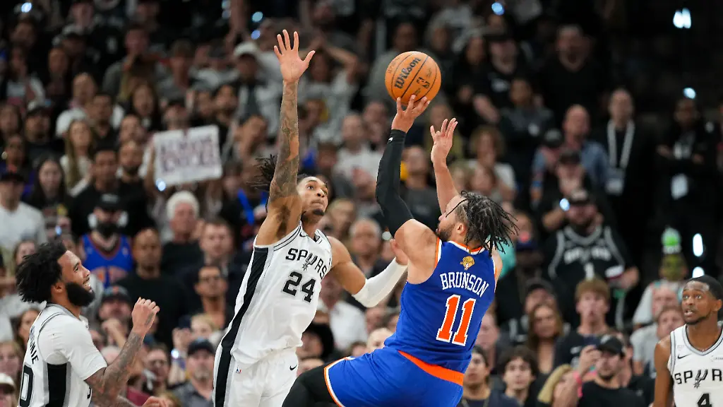 Jun-5-2026-San-Antonio-Texas-USA-New-York-Knicks-guard-Jalen-Brunson-11-makes-a-jump-shot-over-San-Antonio-Spurs-guard-Devin-Vassell-24-in-the-second-half-during-game-two-of-the-2026-NBA-Finals-at-Frost-Bank-Center