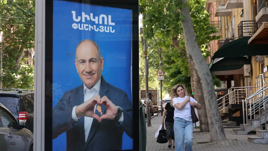 People-walk-past-campaign-banners-with-portraits-of-Prime-Minister-Nikol-Pashinyan-of-the-Civil-Contract-party-ahead-of-the-June-7-parliamentary-election-in-Yerevan-Armenia-June-3-2026-Hayk-Baghdasaryan-Photolure-via-REUTERS-ATTENTION-EDITORS-THIS-IMAGE-HAS-BEEN-SUPPLIED-BY-A-THIRD-PARTY