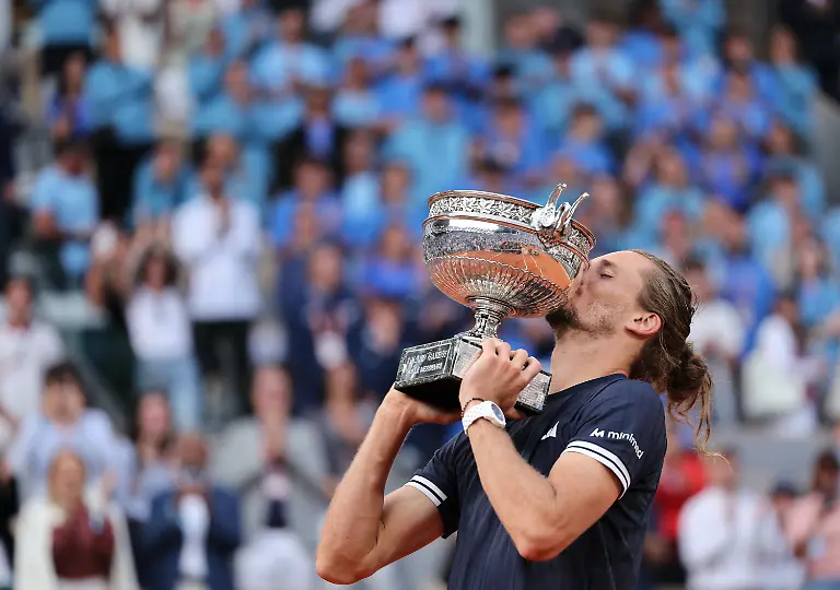 260608-PARIS-June-8-2026-Alexander-Zverev-kisses-the-trophy-during-the-awarding-ceremony-after-the-men-s-singles-final-match-between-Alexander-Zverev-of-Germany-and-Flavio-Cobolli-of-Italy-at-the-French-Open-tennis-tournament-at-Roland-Garros-Paris-France-June-7-2026
