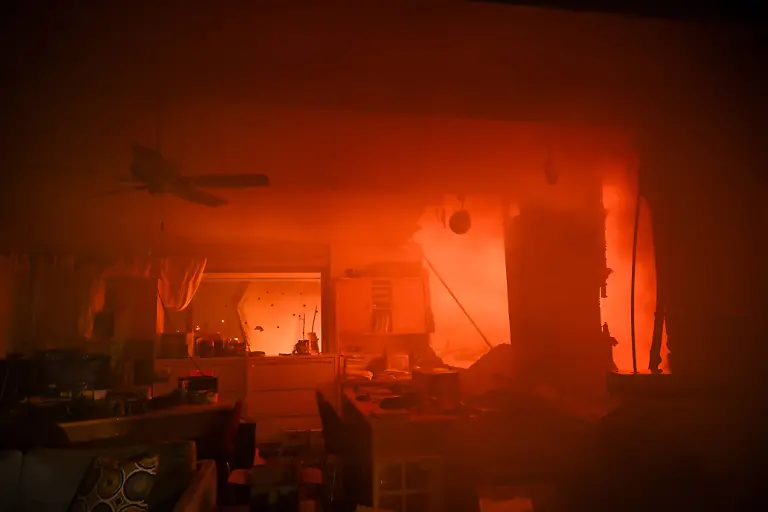 Wildfires-tear-through-Los-Angeles-CALIFORNIA-UNITED-STATES-JANUARY-8-A-church-on-fire-as-residents-try-to-escape-the-site-in-Pacific-Palisades-California-Los-Angeles-United-States-on-January-8-2025-A-fast-moving-wildfire-has-forced-30-000-people-to-evacuate-with-officials-warning-that-worsening-winds-could-further-escalate-the-blaze-United-States-World-Editorial-use-only-Please-get-in-touch-for-any-other-usage