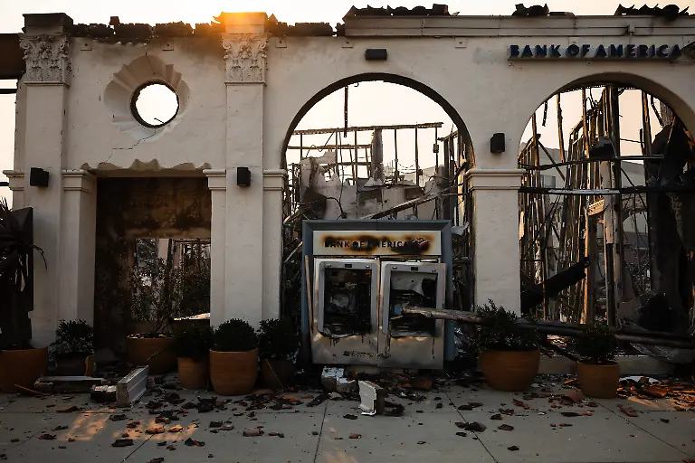 A-melted-ATM-machine-is-left-among-the-ruins-of-a-Bank-of-America-building-destroyed-in-the-Palisades-Fire-in-Pacific-Palisades-a-neighborhood-of-Los-Angeles-California-January-8-2025-At-least-five-people-are-now-known-to-have-died-in-wildfires-raging-around-Los-Angeles-with-more-deaths-feared-law-enforcement-said-January-8-as-terrifying-blazes-leveled-whole-streets-torching-cars-and-houses-in-minutes-More-than-1-000-buildings-have-burned-in-multiple-wildfires-that-have-erupted-around-America-s-second-biggest-city-forcing-tens-of-thousands-of-people-from-their-homes