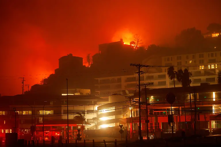 A-building-burns-during-the-Palisades-Fire-in-the-Pacific-Palisades-neighborhood-of-west-Los-Angeles-California-January-7-2025