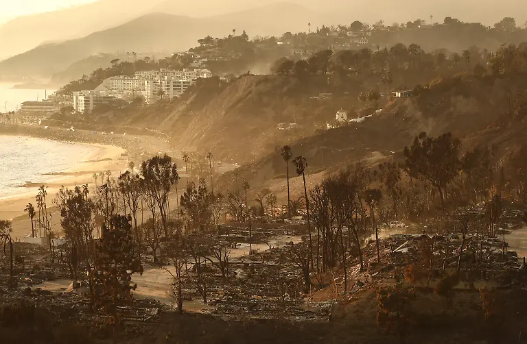 PACIFIC-PALISADES-CALIFORNIA-JANUARY-10-A-view-of-destroyed-homes-as-the-Palisades-Fire-continues-to-burn-with-wildfires-causing-damage-and-loss-through-Los-Angeles-County-on-January-10-2025-in-Pacific-Palisades-California-Multiple-wildfires-fueled-by-intense-Santa-Ana-Winds-are-burning-across-Los-Angeles-County-Reportedly-at-least-10-people-have-died-with-over-180-000-people-having-been-under-evacuation-orders-Over-9-000-structures-have-been-damaged-or-burned-while-more-than-more-than-25-000-acres-were-burning-from-the-fires