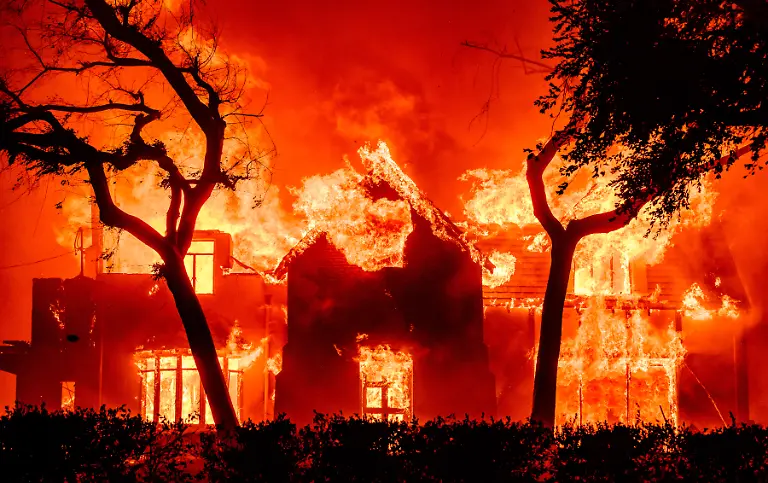 A-home-is-engulfed-in-flames-during-the-Eaton-fire-in-the-Altadena-area-of-Los-Angeles-County-California-on-January-8-2025