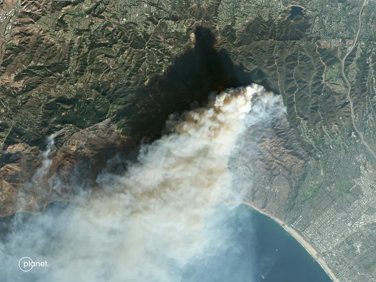 This-handout-satellite-image-released-by-Planet-Labs-PBC-shows-an-overview-of-the-Palisades-Fire-in-Pacific-Palisades-a-neighborhood-of-Los-Angeles-California-January-9-2025-At-least-five-people-have-been-killed-in-wildfires-rampaging-around-Los-Angeles-officials-said-on-January-8-with-firefighters-overwhelmed-by-the-speed-and-ferocity-of-multiple-blazes-including-in-Hollywood