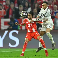 Muenchen-Allianz-Arena-15-04-26-GER-Herren-UEFA-Champions-League-Viertelfinale-Saison-2025-2026-FC-Bayern-Muenchen-Real-Madrid-Bild-v-li-im-Zweikampf-Michael-OLISE-Muenchen-und-Jude-BELLINGHAM-Real-Madrid-UEFA-regulations-prohibit-any-use-of-photographs-as-image-sequences-and-or-quasi-video