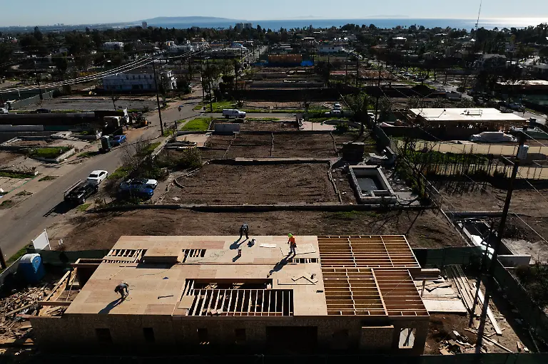 An-aerial-view-shows-houses-being-rebuilt-on-cleared-lots-months-after-the-Palisades-Fire-Dec-5-2025-in-the-Pacific-Palisades-neighborhood-of-Los-Angeles-AP-Photo-Jae-C