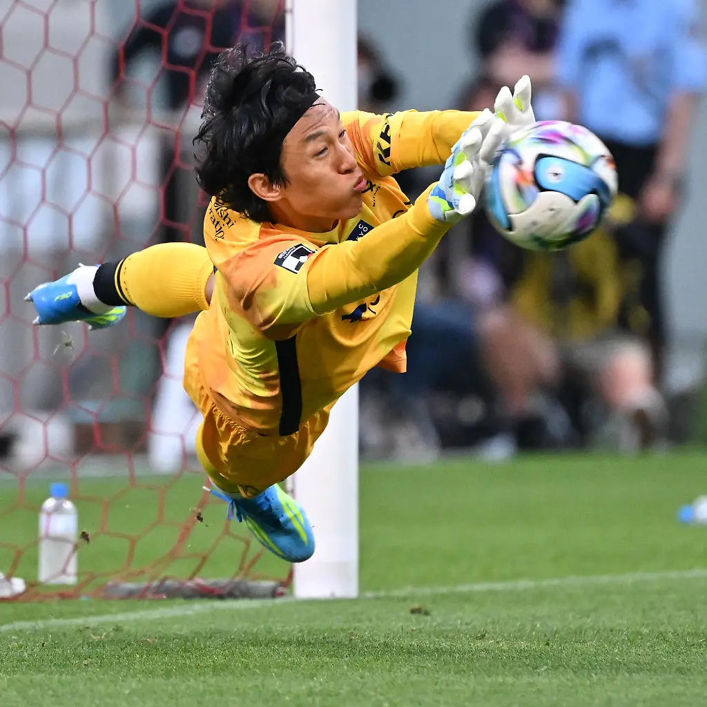 FC-Tokyo-goalkeeper-KIM-Seung-Gyu-saves-a-shot-of-the-Urawa-Reds-MIYAMOTO-Yuta-during-the-penalty-shootout-of-a-football-match-at-the-J1-100-Year-Vision-League-at-Saitama-Stadium-2002-in-Saitama-City-Saitama-on-May-16-2026