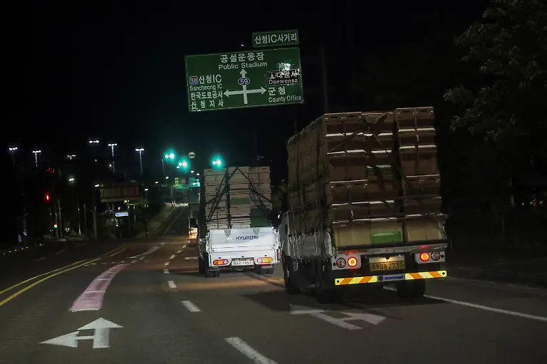 Trucks-transporting-beehives-for-migratory-beekeeping-travel-in-Sancheong-South-Korea-May-4-2026-Park-Gyeong-je-moves-his-bees-around-the-country-stacked-on-the-back-of-three-trucks-and-a-van-travelling-mostly-in-the-evening-while-the-bees-sleep-Beekeepers-exchange-information-about-where-flowers-are-in-bloom-and-where-conditions-are-good-to-figure-out-the-best-honey-making-routes-he-said-REUTERS-Kim-Hong-Ji-SEARCH-HONG-JI-SOUTH-KOREA-BEES-FOR-THIS-STORY-SEARCH-WIDER-IMAGE-FOR-ALL-STORIES