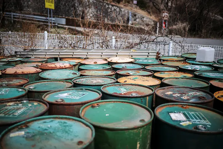 Rusty-honey-drums-at-Park-Gyeong-je-s-beekeeping-farm-in-Sancheong-South-Korea-March-24-2026-Park-runs-a-beekeeping-farm-in-South-Korea-s-southern-Sancheong-county-but-he-is-a-migratory-beekeeper-meaning-he-criss-crosses-the-country-with-his-hives-to-chase-seasonal-flower-blooms-However-rising-temperatures-due-to-climate-change-are-shortening-seasons-causing-flowers-to-bloom-earlier-and-for-shorter-periods-The-weather-changes-have-also-brought-strong-winds-which-can-make-it-harder-for-bees-to-find-their-way-back-to-their-hives-REUTERS-Kim-Hong-Ji-SEARCH-HONG-JI-SOUTH-KOREA-BEES-FOR-THIS-STORY-SEARCH-WIDER-IMAGE-FOR-ALL-STORIES