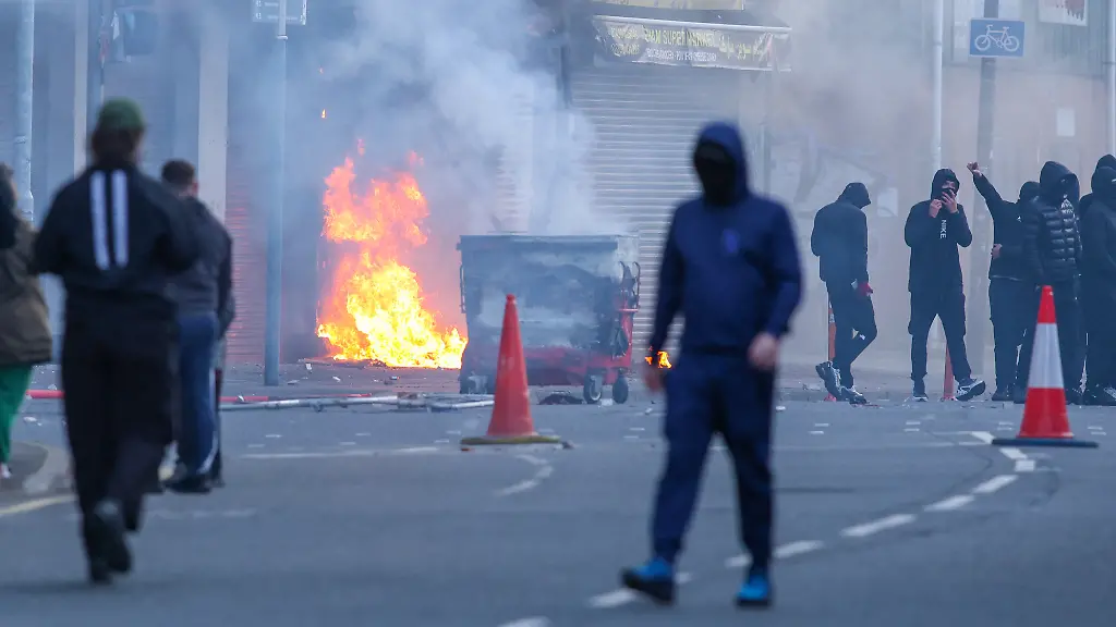A-building-is-set-alight-in-the-Sandy-Row-area-of-Belfast-city-centre-Northern-Ireland-in-the-evening-of-June-9-2026-Northern-Ireland-police-appealed-for-calm-Tuesday-after-a-stabbing-in-Belfast-allegedly-by-a-Sudanese-suspect-and-captured-in-a-graphic-video-prompted-calls-for-anti-immigration-protests-from-UK-far-right-figures