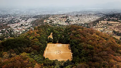 A-drone-view-shows-a-sports-field-known-as-the-Field-of-the-Gods-inside-the-crater-of-the-Teoca-volcano-an-inactive-volcano-at-more-than-2-700-metres-above-sea-level-where-amateur-tournaments-are-played-every-Sunday-in-Mexico-City-Mexico-April-19-2026-REUTERS-Raquel-Cunha-SEARCH-CUNHA-MEXICO-SOCCER-FOR-THIS-STORY-SEARCH-WIDER-IMAGE-FOR-ALL-STORIES