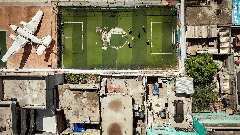 A-drone-view-shows-a-soccer-field-next-to-an-aircraft-fuselage-at-Avioneta-Park-in-Ecatepec-one-of-the-most-densely-populated-municipalities-in-the-State-of-Mexico-on-the-outskirts-of-Mexico-City-Mexico-April-29-2026-REUTERS-Raquel-Cunha-SEARCH-CUNHA-MEXICO-SOCCER-FOR-THIS-STORY-SEARCH-WIDER-IMAGE-FOR-ALL-STORIES