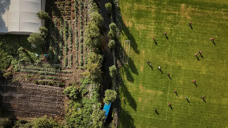 Locals-play-football-at-a-pitch-next-to-a-plantation-in-the-Xochimilco-ecological-zone-composed-of-water-channels-and-chinampas-floating-gardens-a-reminder-of-traditional-pre-Hispanic-land-use-in-Mexico-City-Mexico-May-24-2026-REUTERS-Raquel-Cunha-SEARCH-CUNHA-MEXICO-SOCCER-FOR-THIS-STORY-SEARCH-WIDER-IMAGE-FOR-ALL-STORIES