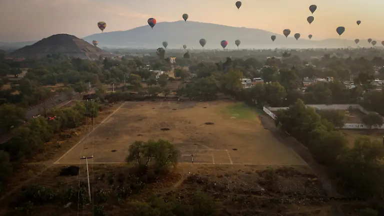 A-drone-view-shows-a-soccer-field-as-hot-air-balloons-float-near-the-Teotihuacan-pyramids-on-the-outskirts-of-Mexico-City-Mexico-April-12-2026-REUTERS-Raquel-Cunha-SEARCH-CUNHA-MEXICO-SOCCER-FOR-THIS-STORY-SEARCH-WIDER-IMAGE-FOR-ALL-STORIES