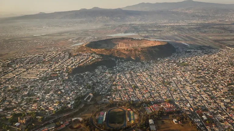 A-drone-view-shows-a-soccer-field-at-the-Sports-Unit-Luis-Donaldo-Colosio-with-the-crater-of-the-Xico-volcano-an-almost-perfectly-circular-tuff-ring-known-locally-as-the-navel-of-the-world-on-the-outskirts-of-Mexico-City-Mexico-April-8-2026-REUTERS-Raquel-Cunha-SEARCH-CUNHA-MEXICO-SOCCER-FOR-THIS-STORY-SEARCH-WIDER-IMAGE-FOR-ALL-STORIES