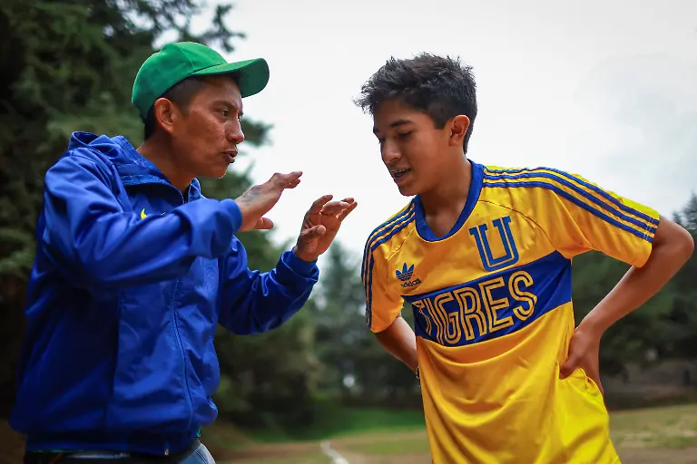 San-Isidro-coach-Jorge-Baltazar-left-talks-with-player-Alexis-Rodriguez-during-an-amateur-league-match-against-Bombay-at-the-Cancha-de-los-Dioses-Field-of-the-Gods-a-soccer-field-inside-the-crater-of-the-dormant-Teoca-volcano-in-the-mountains-between-Xochimilco-and-Milpa-Alta-in-Mexico-City-Mexico-May-24-2026-The-community-flattened-the-crater-more-than-60-years-ago-to-build-the-field-where-local-amateur-teams-play-matches-every-Sunday-REUTERS-Raquel-Cunha-SEARCH-CUNHA-MEXICO-SOCCER-FOR-THIS-STORY-SEARCH-WIDER-IMAGE-FOR-ALL-STORIES