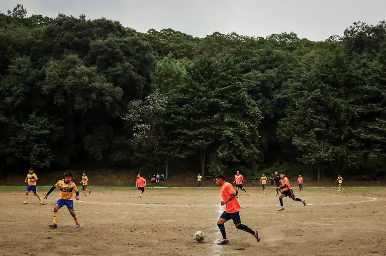 Locals-play-at-the-match-San-Isidro-vs-Real-Bombay-for-the-amateur-soccer-league-games-at-the-Cancha-de-los-Dioses-Field-of-the-Gods-a-soccer-field-inside-the-crater-of-the-dormant-Teoca-volcano-in-the-mountains-between-Xochimilco-and-Milpa-Alta-in-Mexico-City-Mexico-May-24-2026-The-community-flattened-the-crater-more-than-60-years-ago-to-build-the-field-where-local-amateur-teams-play-matches-every-Sunday-REUTERS-Raquel-Cunha-SEARCH-CUNHA-MEXICO-SOCCER-FOR-THIS-STORY-SEARCH-WIDER-IMAGE-FOR-ALL-STORIES