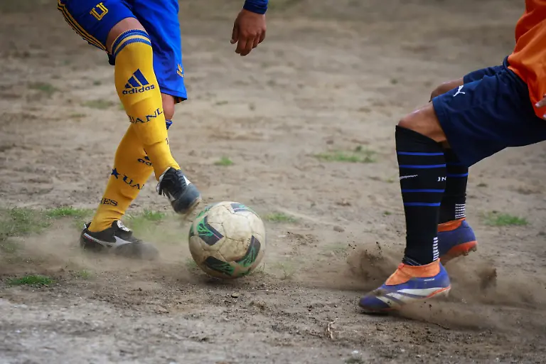 A-San-Isidro-team-player-disputes-the-ball-with-a-Bombay-player-during-a-match-for-the-amateur-soccer-league-games-at-the-Cancha-de-los-Dioses-Field-of-the-Gods-a-soccer-field-inside-the-crater-of-the-dormant-Teoca-volcano-in-the-mountains-between-Xochimilco-and-Milpa-Alta-in-Mexico-City-Mexico-May-24-2026-The-community-flattened-the-crater-more-than-60-years-ago-to-build-the-field-where-local-amateur-teams-play-matches-every-Sunday-REUTERS-Raquel-Cunha-SEARCH-CUNHA-MEXICO-SOCCER-FOR-THIS-STORY-SEARCH-WIDER-IMAGE-FOR-ALL-STORIES