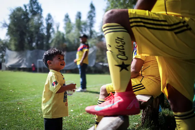 Emmanuel-Dela-Rosa-2-looks-at-his-father-during-an-amateur-league-match-between-Real-America-and-Mexico-in-the-protected-Xochimilco-area-in-southern-Mexico-City-Mexico-March-8-2026-The-UNESCO-World-Heritage-site-known-for-its-canals-and-chinampas-or-so-called-floating-gardens-remains-a-social-hub-where-residents-gather-for-weekend-football-matches-REUTERS-Raquel-Cunha-SEARCH-CUNHA-MEXICO-SOCCER-FOR-THIS-STORY-SEARCH-WIDER-IMAGE-FOR-ALL-STORIES