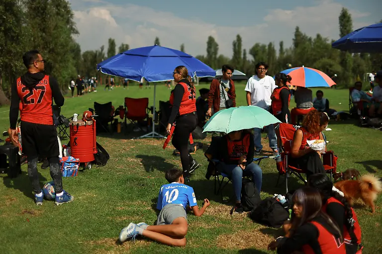 Flag-football-players-wait-as-they-watch-an-amateur-football-match-in-the-Xochimilco-ecological-zone-composed-of-water-channels-and-chinampas-or-so-called-floating-gardens-a-reminder-of-traditional-pre-Hispanic-land-use-in-Mexico-City-Mexico-May-24-2026-REUTERS-Raquel-Cunha-SEARCH-CUNHA-MEXICO-SOCCER-FOR-THIS-STORY-SEARCH-WIDER-IMAGE-FOR-ALL-STORIES