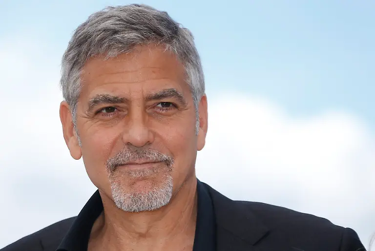 epa05301564-US-actor-George-Clooney-poses-during-the-photocall-for-Money-Monster-at-the-69th-annual-Cannes-Film-Festival-in-Cannes-France-12-May-2016-The-movie-is-presented-out-of-competition-at-the-festival-which-runs-from-11-to-22-May