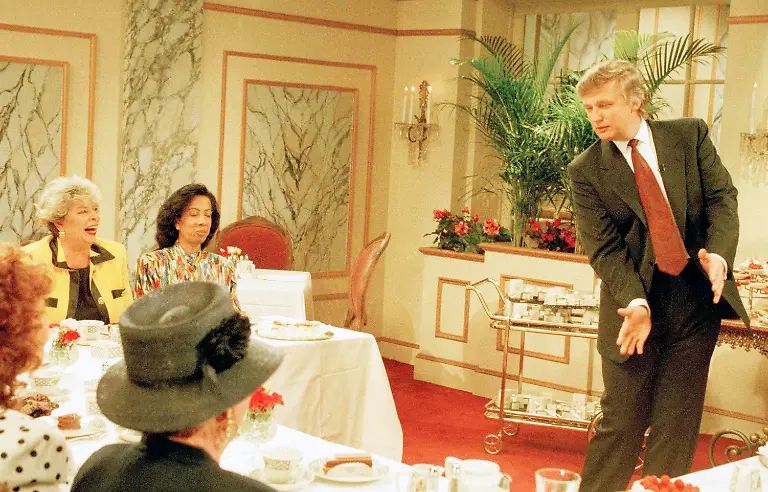 Real-estate-magnate-Donald-Trump-makes-a-sweeping-gesture-as-he-tapes-a-guest-appearance-for-a-Mothers-Day-episode-on-NBC-s-Saturday-Night-Live-in-New-York-April-13-1993-The-financier-revealed-last-week-he-is-to-become-a-father-again-by-his-on-again-off-again-companion-Marla-Maples