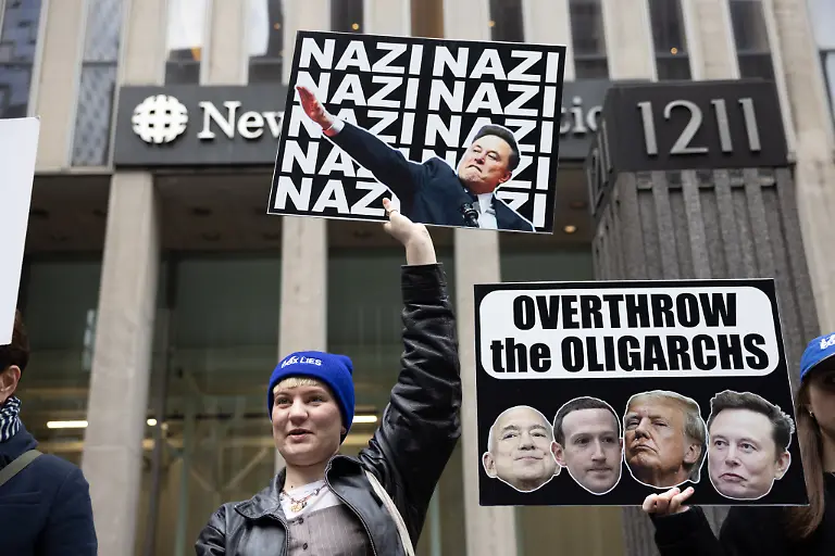 Demonstrators-And-Supporters-Hold-Signs-And-Chant-At-A-Stop-Musk-Rally-Outside-Fox-News-News-Corp-Headquarters-On-February-25-2025-in-New-York-USA-Participants-Spoke-Out-Against-President-Donald-Trump-s-Executive-Orders-Fox-News-Lies-About-Voting-Systems-During-The-2020-Election-And-Also-About-Elon-Musk-s-So-called-Department-Of-Government-Efficiency-DOGE-DOGE-Has-Been-Working-To-Dismantle-Entire-Federal-Agencies-Without-Congressional-Authorization-And-To-Indiscriminately-Lay-Off-Thousands-Of-Federal-Employees