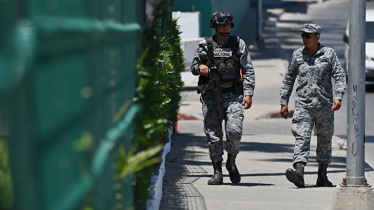 TIJUANA-MEXICO-JUNE-09-Mexican-National-Guard-officers-patrol-outside-the-Marriott-Tijuana-Hotel-on-Tuesday-June-09-2026-in-Tijuana-Mexico-where-Iran-s-National-Team-players-are-staying-overnight-while-conducting-their-training-sessions-at-the-Caliente-Football-Stadium-nearby-before-their-game-in-Los-Angeles-California-for-the-FIFA-2026-World-Cup-football-tournament-Carlos-A